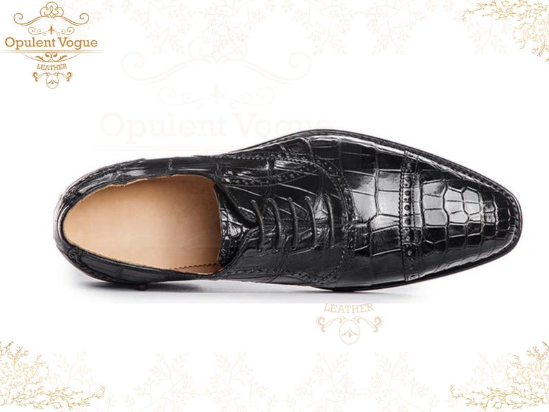 Handmade men’s black crocodile-style textured leather lace-up dress shoes with a polished finish. Crafted with genuine leather upper, cushioned insole, leather lining, and durable outsole for all-day comfort and support. Designed for weddings, parties, office wear, and formal business occasions. A premium handmade shoe that blends luxury, craftsmanship, and timeless sophistication for modern gentlemen. mens formal shoes
wedding shoes men
party wear shoes
business shoes men
polished dress shoes