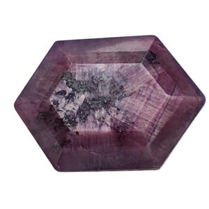 May include: A purple gemstone with a hexagonal shape and a faceted cut.