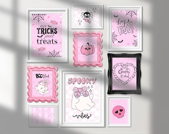 May include: A collection of framed Halloween-themed art prints. The prints feature pink backgrounds with black and white illustrations of ghosts, spiders, pumpkins, and text like "No Tricks Just Treats" and "Spooky Vibes".