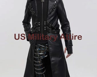 May include: A black long coat featuring a high collar, silver-tone metal rings, and adjustable straps across the chest and waist. The garment includes a front zipper closure and is paired with black trousers adorned with multiple silver chains.