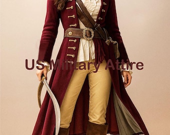 May include: A burgundy long coat with gold buttons, paired with tan pants and brown boots. The coat features a wide belt with a decorative buckle and a leather strap across the chest. The image includes the text "US Military Attire".