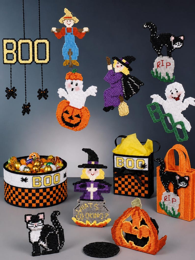 May include: A collection of Halloween-themed plastic canvas decorations including a BOO sign with spiders, a scarecrow, a ghost in a pumpkin, a witch, a cat on a tombstone, a ghost with a BOO sign, a candy basket, a witch in a cauldron, and bags.