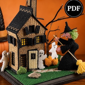 May include: A plastic canvas craft project featuring a tan house with black shutters, a chimney, and yellow windows. A black-clad witch with green hair holds a yellow broom. Two white ghosts, two orange pumpkins, and a green lawn are included.