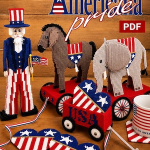 May include: A plastic canvas craft set titled Americana Pride featuring a Uncle Sam figure, a brown donkey, a grey elephant, a red wagon with USA text, two heart-shaped ornaments, and a mug, all decorated with red, white, and blue patterns.