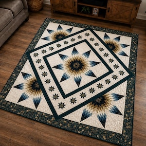 May include: A rectangular quilt featuring a large central star pattern in shades of navy blue, tan, and cream. The design includes a dark teal border with a smaller star motif, surrounded by a floral patterned edge on a dark teal background.