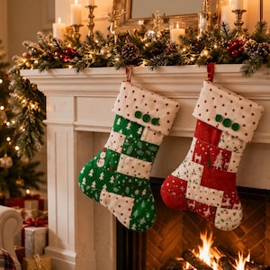 May include: Two quilted Christmas stockings hanging side by side. The left stocking features green and white patches with snowman and tree patterns. The right stocking has red and white patches with reindeer and tree patterns. Both have polka dot cuffs.