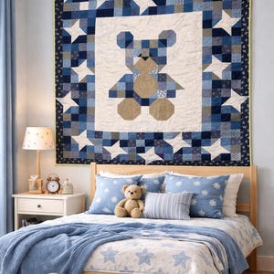May include: A bedroom with a wooden bed, blue bedding, and star-patterned pillows. A large quilt with a bear design is on the wall. A teddy bear sits on the bed, and another on the rug. The room has a light blue colour scheme.