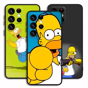 May include: Three phone cases featuring Homer Simpson from The Simpsons cartoon. The cases are in lime green, blue, and black. Each case has a different image of Homer Simpson in various poses. The cases are made of a glossy material.