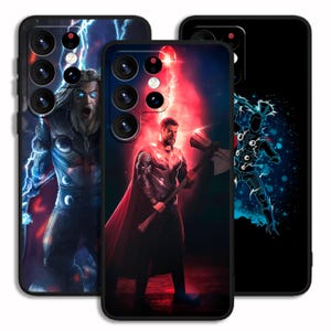 May include: Three phone cases with different designs featuring the superhero Thor. The first case has a blue and white design with Thor holding his hammer. The second case has a red and black design with Thor holding his hammer. The third case has a black and blue design with a silhouette of Thor holding his hammer.