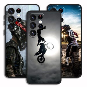 May include: Three phone cases with different designs. The first case features a black and white photo of a motocross rider performing a stunt. The second case features a silhouette of a motocross rider performing a stunt against a cloudy sky. The third case features a colorful photo of a motocross rider in action.