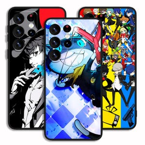 May include: Three phone cases with anime-style character designs. One case features a black and white illustration of a character with a blue accent. Another case has a blue and white diamond pattern with a cartoon cat. The third case has a colourful collage of anime characters.