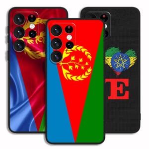 May include: Three phone cases with different designs. The first case features a blue, red, and yellow flag with a gold emblem. The second case features a blue, red, and green flag with a gold emblem. The third case features a black background with a red letter E and a heart-shaped Ethiopian flag.