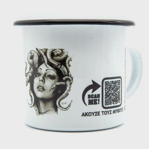 May include: White enamel mug with a black rim and handle. The mug features a detailed black and white illustration of Medusa. Text on the mug includes "SCAN ME!" and Greek text. A QR code is also present.