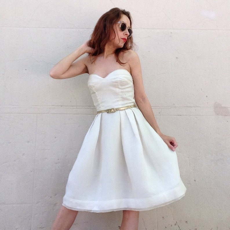white dress with gold trim