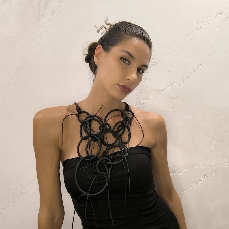 Avant-garde black cable necklace, bold handmade accessory for extravagant and artistic fashion looks."