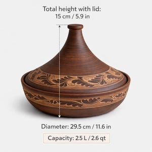 May include: A brown ceramic tagine pot with a conical lid and decorative leaf patterns. The pot has a diameter of 29.5 cm and a total height of 15 cm with the lid. Capacity is 2.5 litres.