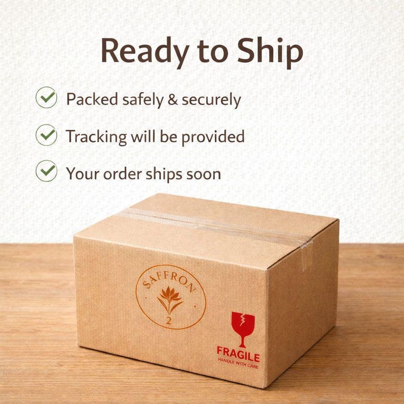May include: A brown cardboard box with the text "Ready to Ship" and a "Fragile" symbol. The box has a circular logo with the word "SAFFRON" and the number "2". The text "Packed safely & securely", "Tracking will be provided", and "Your order ships soon" are also visible.