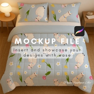 May include: A light blue bedding set featuring a repeating pattern of white llamas, pink and yellow flowers, and green leaves. The text "MOCKUP FILE" and "Insert and showcase your designs with ease" are displayed on the comforter.
