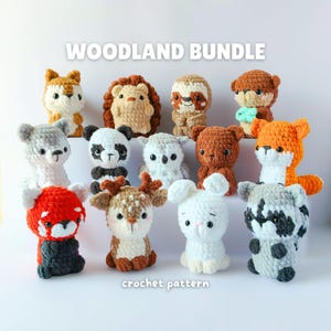 May include: A selection of crocheted woodland animal toys, featuring a fox, bear, panda, and deer. The toys are in shades of orange, brown, white, and grey. The image includes the text "WOODLAND BUNDLE" and "crochet pattern".