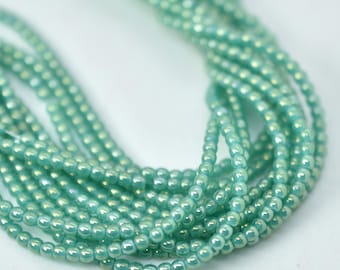 100 Beads - 2mm Druk - Atlantis Green Luster Iris - Czech Glass Rounds