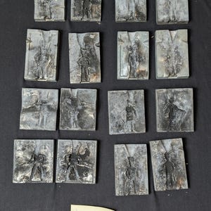 May include: A set of three ceramic mugs with a speckled, matte finish. The mugs are in shades of cream, light gray, and dark gray. Each mug has a simple, minimalist design, perfect for coffee or tea.