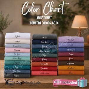 May include: A color chart for Comfort Colors 6014 sweatshirts, displaying three stacks of folded garments in various shades including white, ivory, chambray, blossom, ice blue, island reef, seafoam, bay, blue jean, pepper, grey, navy, and more.