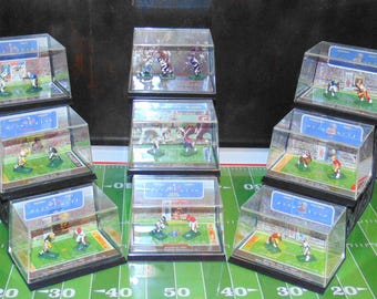 Electric Football Figures Display featuring NFL Super Bowl, WFL and USFL Championship Games