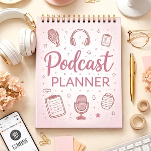 May include: A pink spiral-bound "Podcast Planner" notebook with microphone and headphone illustrations. The image includes a coffee cup, headphones, a microphone, a smartphone, and a keyboard, suggesting a podcasting setup.