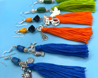 Lightweight, lovely earrings with tassels, accented with charms. Match your mood, match your vibe! Add a pop of color with tassel earrings.