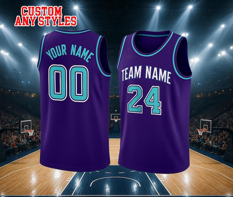 May include: Two purple basketball jerseys with teal and white trim. The left jersey features the text YOUR NAME and the number 00 in teal with white outlines. The right jersey displays TEAM NAME and the number 24 in white with teal outlines.