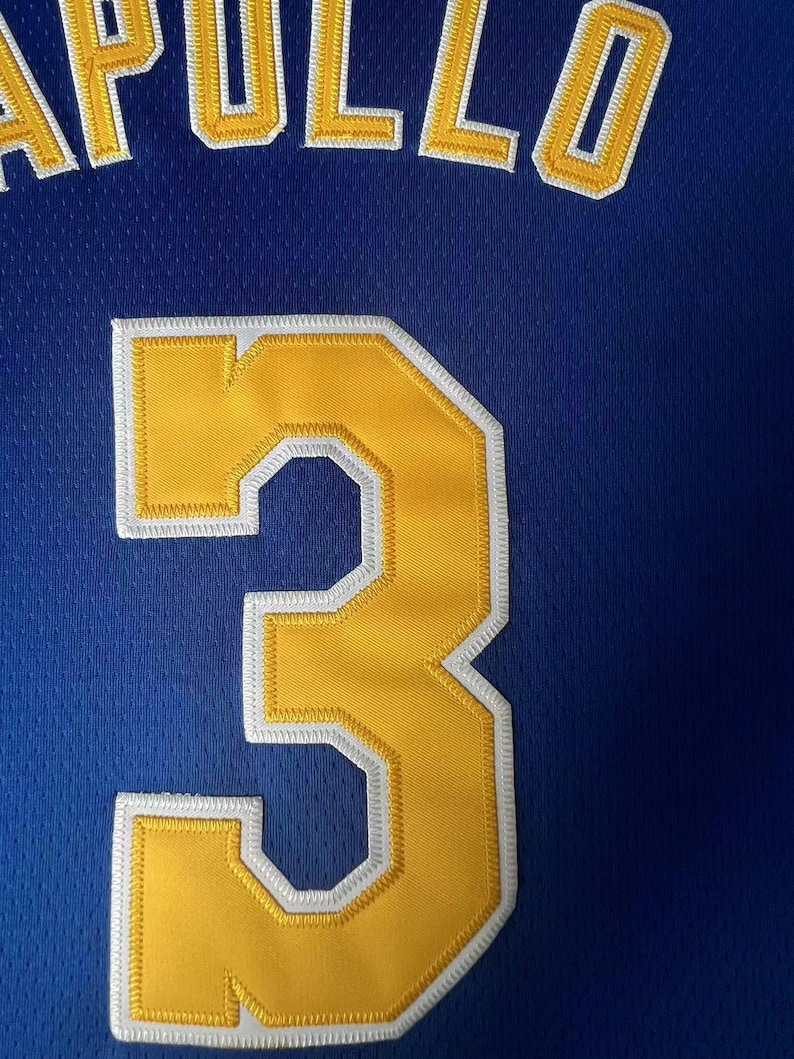 May include: A royal blue athletic jersey featuring the name APOLLO in yellow block letters with white trim, positioned above a large yellow number 3 with white trim. The fabric has a visible mesh texture throughout the entire garment surface.