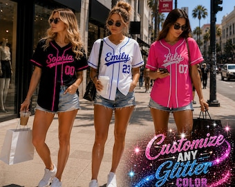 May include: Three baseball jerseys with button-front closures and short sleeves. The black jersey features pink text reading Sophia 00, the white jersey has blue text reading Emily 23, and the pink jersey has white text reading Lily 07.