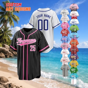 May include: Baseball jerseys in various colors and designs, displayed on a beach background. The jerseys feature custom text and numbers, with options including black pinstripes with pink accents, and white with blue stripes. Text on the image reads "CUSTOM ANY DESIGNS".
