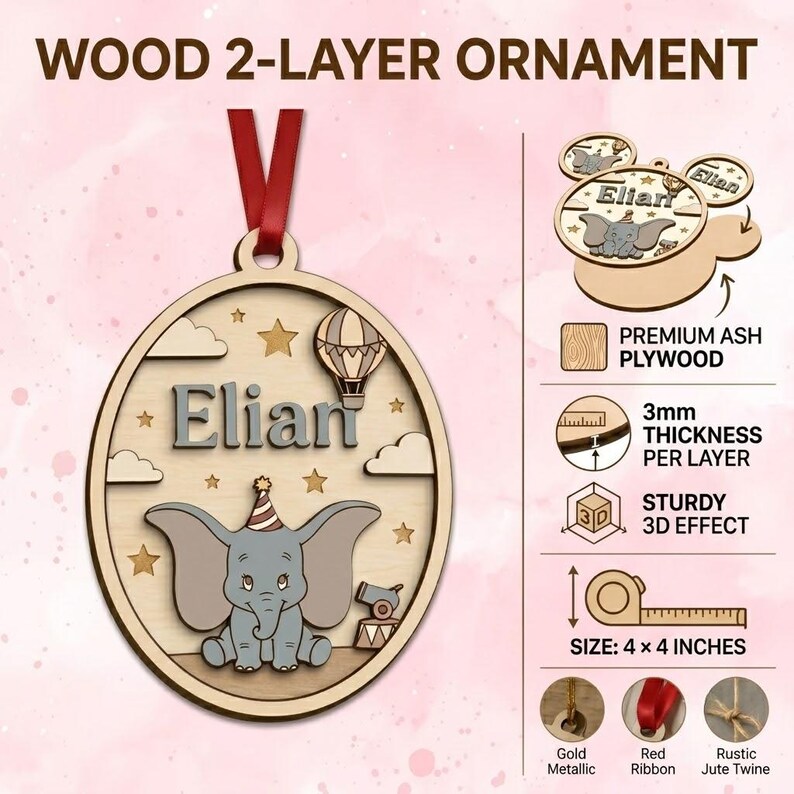May include: A two-layer oval wood ornament featuring a gray elephant with a party hat, a hot air balloon, stars, and clouds. The name Elian is printed in gray. It includes a red ribbon, measures 4 x 4 inches, and is made of 3mm thick ash plywood.