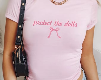 Protect The Dolls Coquette Bow Baby Tee, Gender Equality Shirt, Baby Tee, Feminist Tee, Human Rights Shirt, Feminism Shirt, LGBT Rights Tee