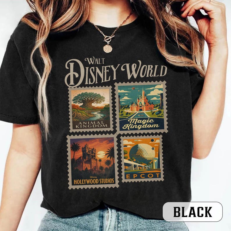 May include: Black t-shirt featuring a Walt Disney World design. The design includes four postage stamp-style images representing Animal Kingdom, Magic Kingdom, Hollywood Studios, and Epcot. The shirt also has the word "BLACK" printed on it.