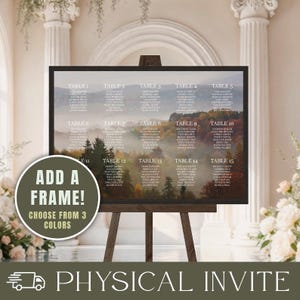 May include: A rectangular wedding seating chart sign displayed on a wooden easel, featuring a misty mountain forest background with white text listing guests for tables one through fifteen and a circular overlay stating ADD A FRAME!