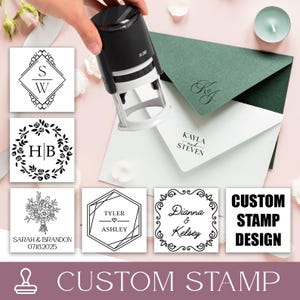 May include: A black custom stamp with a white base is held over examples of stamped designs. The designs include floral wreaths, geometric shapes, and names. The text "CUSTOM STAMP DESIGN" is also displayed.