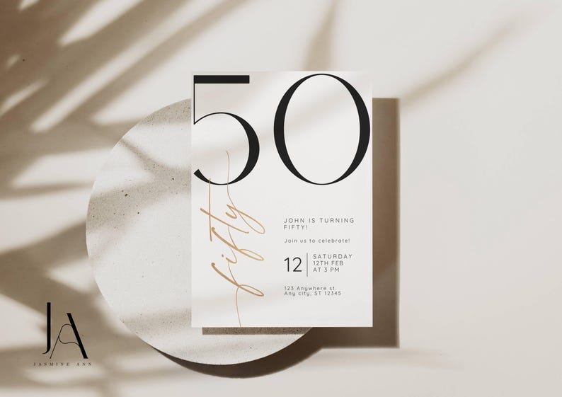 May include: A white rectangular invitation card featuring the large black number 50 at the top. The word fifty is written in a thin gold script font vertically. Text includes John is turning fifty, join us to celebrate, Saturday 12th Feb at 3 PM, and 123 Anywhere st, Any city, ST 12345.