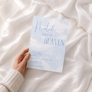 May include: A rectangular invitation card featuring a light blue sky with white clouds background. The text reads Match MADE IN HEAVEN, JOIN US FOR OLIVIA'S BRIDAL SHOWER, Saturday, October 5th, at 2 pm, 123 ANYWHERE ST. ANY CITY, ST 12345, RSVP AT 123-456-7890.