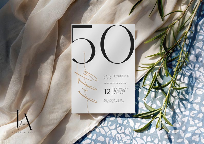 May include: A white rectangular invitation card featuring the large black number 50 and the word fifty in a thin gold script. The text reads John is turning fifty, join us to celebrate, Saturday 12th Feb at 3 PM, 123 Anywhere st, Any City, ST 12345.