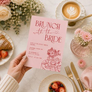 May include: A rectangular pink invitation card with dark red text reading BRUNCH with the BRIDE, featuring a line art illustration of a tea set and flowers. The text includes event details for Olivia's bridal shower on October 5th at 2 pm.