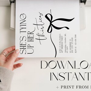 May include: A white invitation with black text, printed from a printer. The invitation reads "She's Tying Up Her Thirties" with details for a 40th birthday party. The invitation also says "Download Instantly + Print From Home."