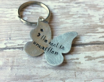 Semi colon keyring- suicide awareness, my story isn't over yet - The rest is unwritten By Inspired Jewelry Designs