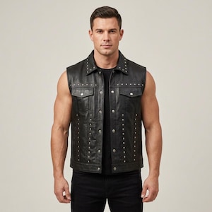 May include: Black leather vest with silver stud accents. The vest features a collared neckline, two chest pockets, and a button-down front. Studs are placed along the collar, pockets, and vertical lines down the front.