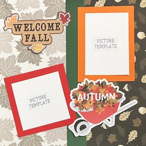 May include: A scrapbook page with a fall theme. It features a welcome fall sign, a picture template, and a wheelbarrow filled with autumn leaves. The text "Autumn" is written on the wheelbarrow.