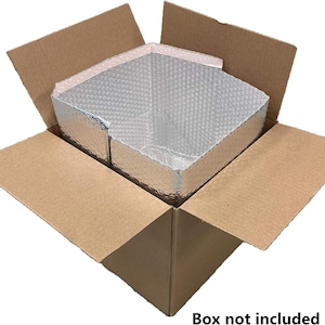 May include: Open cardboard box with a silver insulated liner. The liner is made of a reflective material with a bubble wrap texture. The box is brown and the liner is silver. Text at the bottom reads "Box not included."