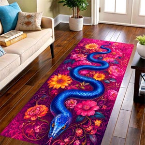 May include: A rectangular rug with a striking design of a blue snake amidst a floral pattern. The flowers are in pink, orange, and yellow hues, set against a deep purple backdrop. The rug is displayed on a wooden floor.