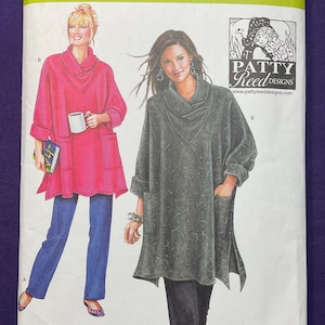 May include: Simplicity sewing pattern 2289 featuring two tunic designs with cowl necks and pockets. The pattern includes sizes XS-XXL. The cover shows illustrations of the finished garments in pink and gray.