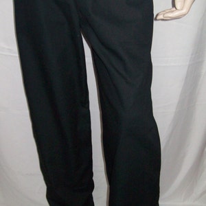 May include: Black pants with a drawstring waist.